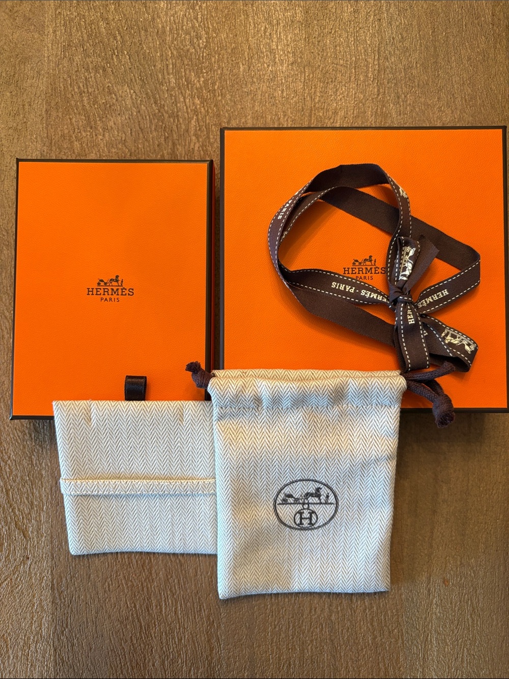 Set of two Hermes boxes/ribbon. One Small Pouch in Beige. For jewelry